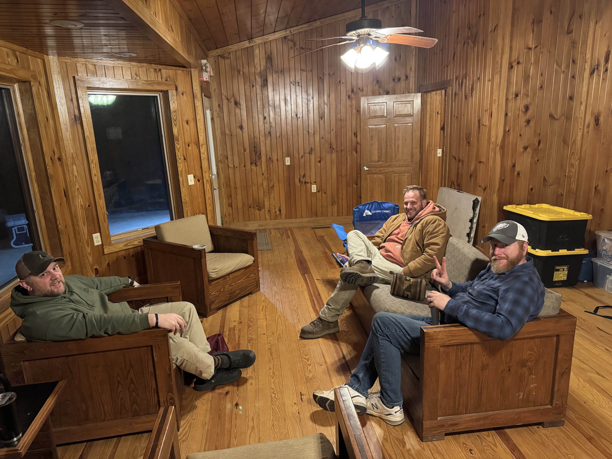 Adult leaders meeting inside the Latimer cabin